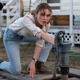 Odessa Young as Frannie Goldsmith. Also pictured: the well.
